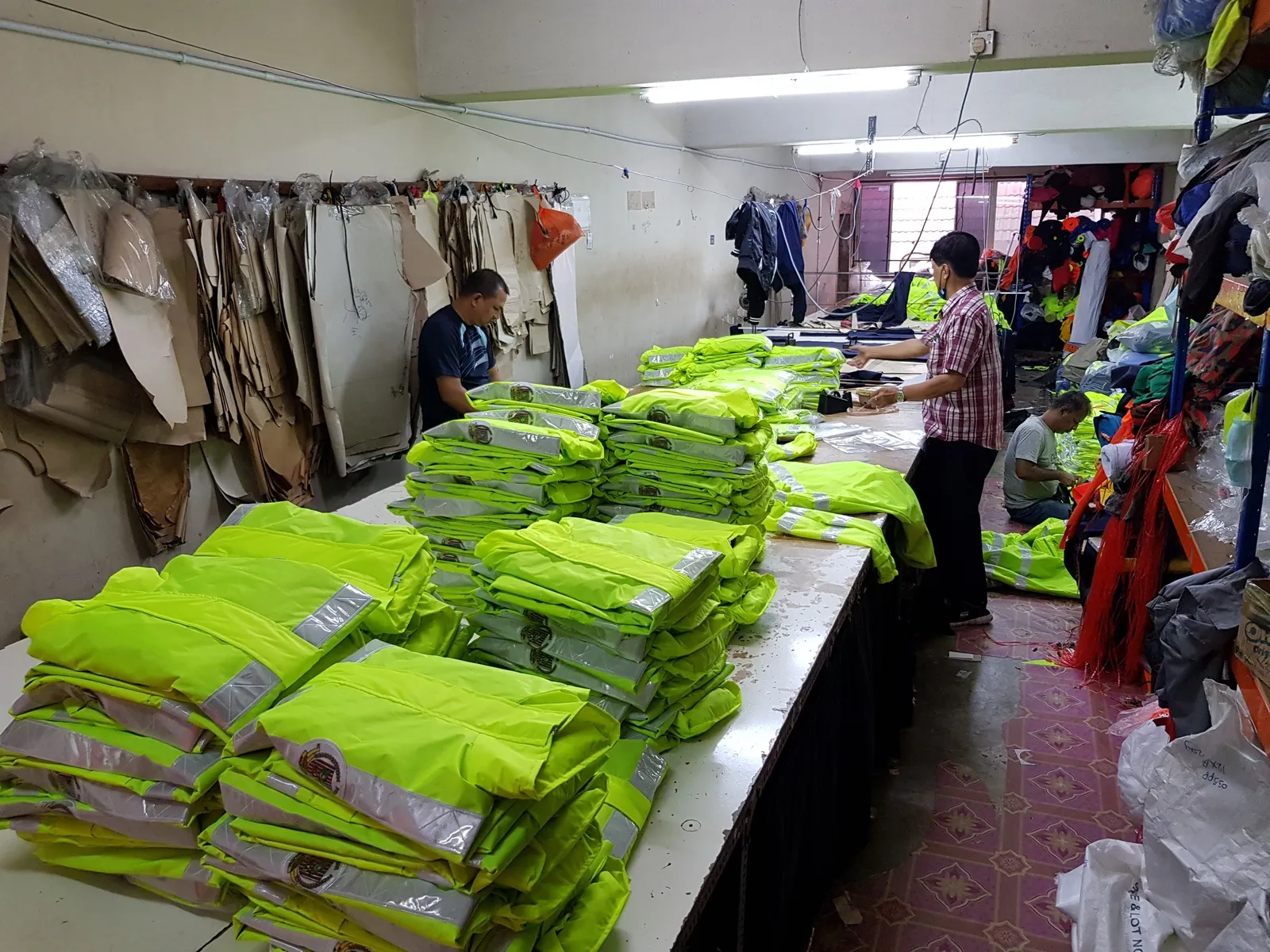 TshirtPrint2u staff checking and preparing garments before delivery